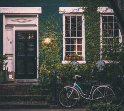 bicycles parked in front of a house