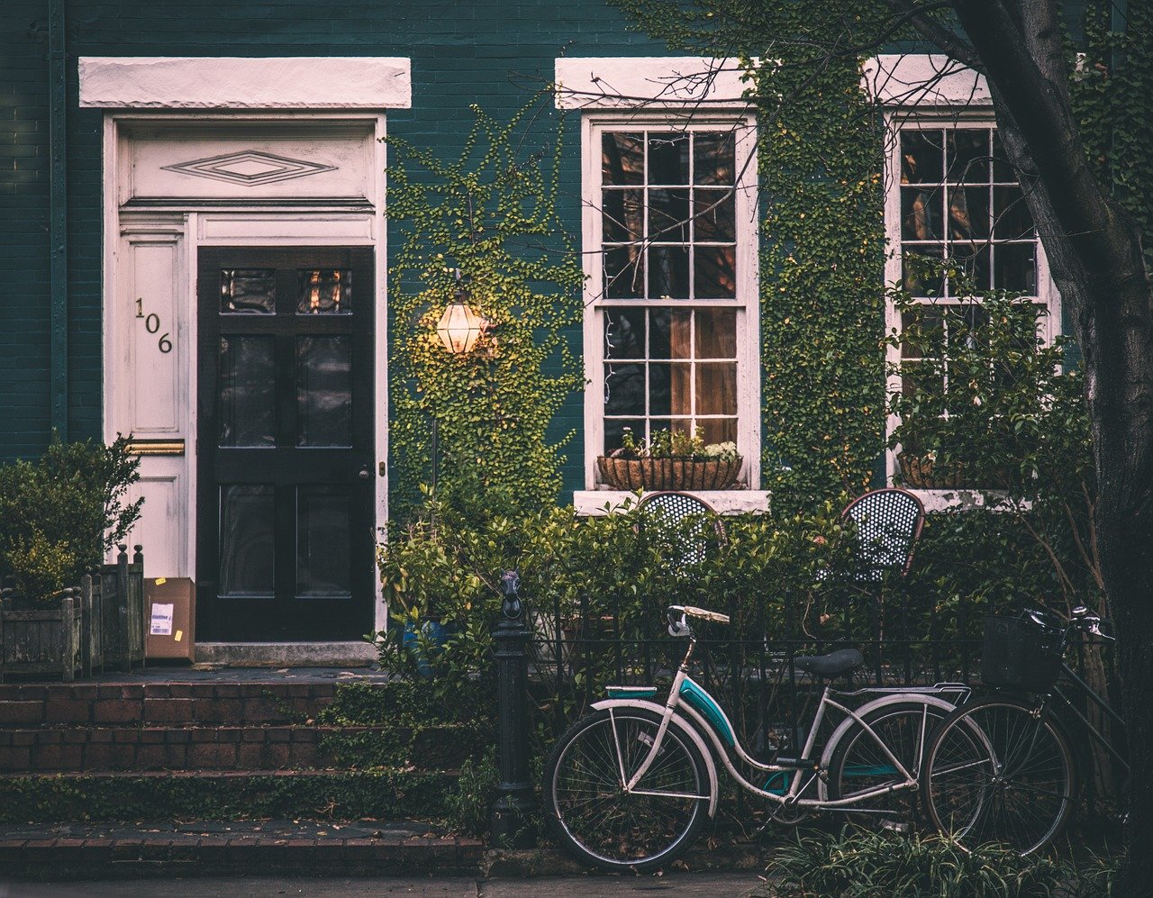 bicycles parked in front of a house