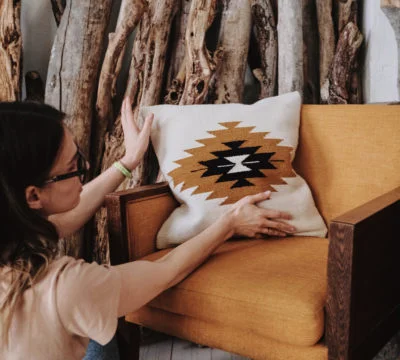 a woman is sitting on a bed