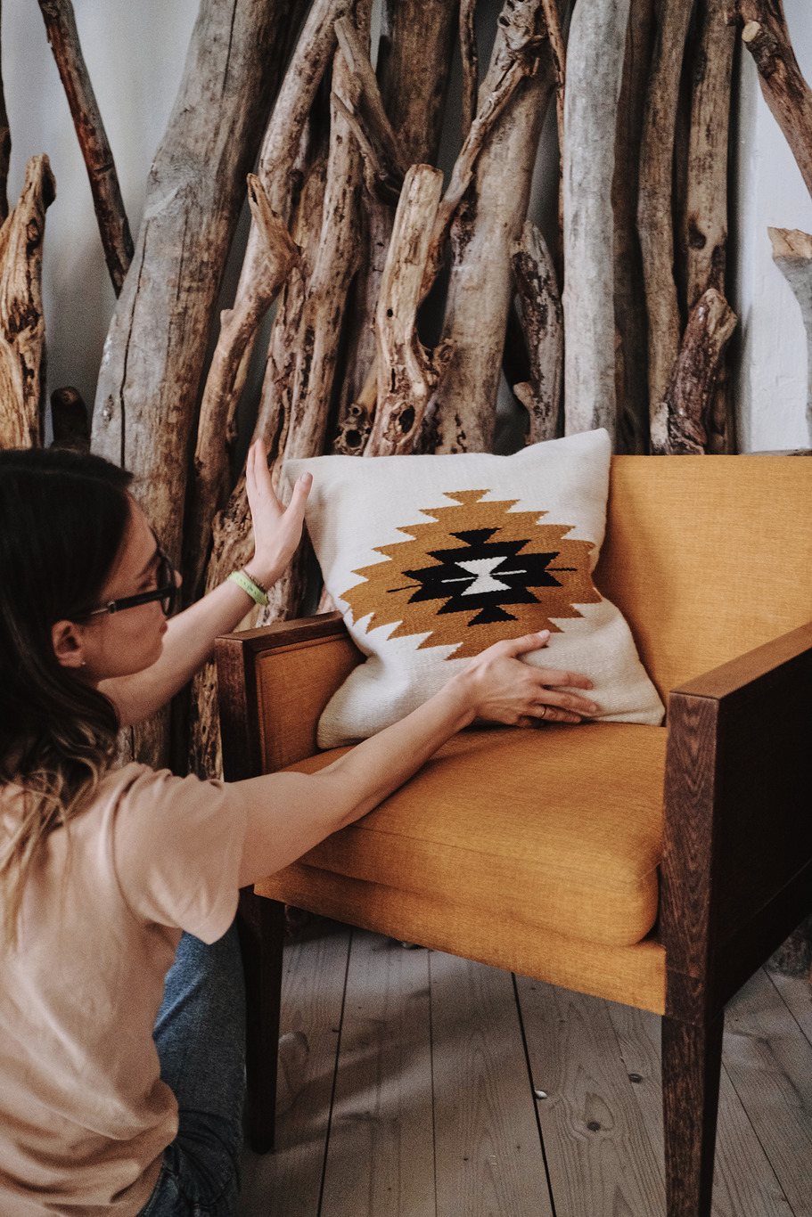 a woman is sitting on a bed