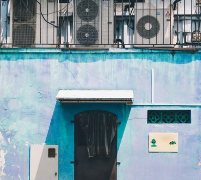 a blue building with a black door