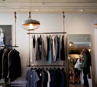 a store with clothes from the ceiling