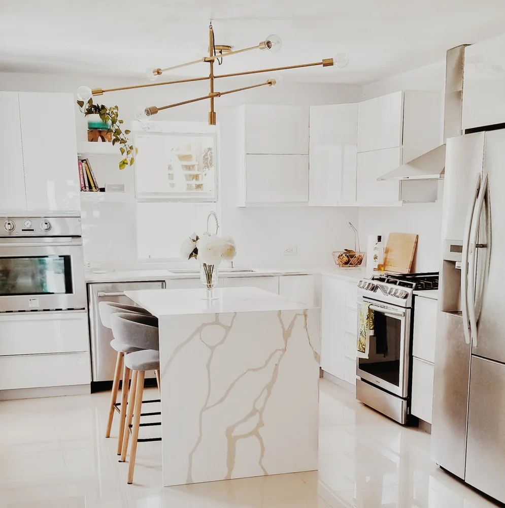 a kitchen with white cabinets