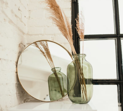 a couple of glasses on a shelf