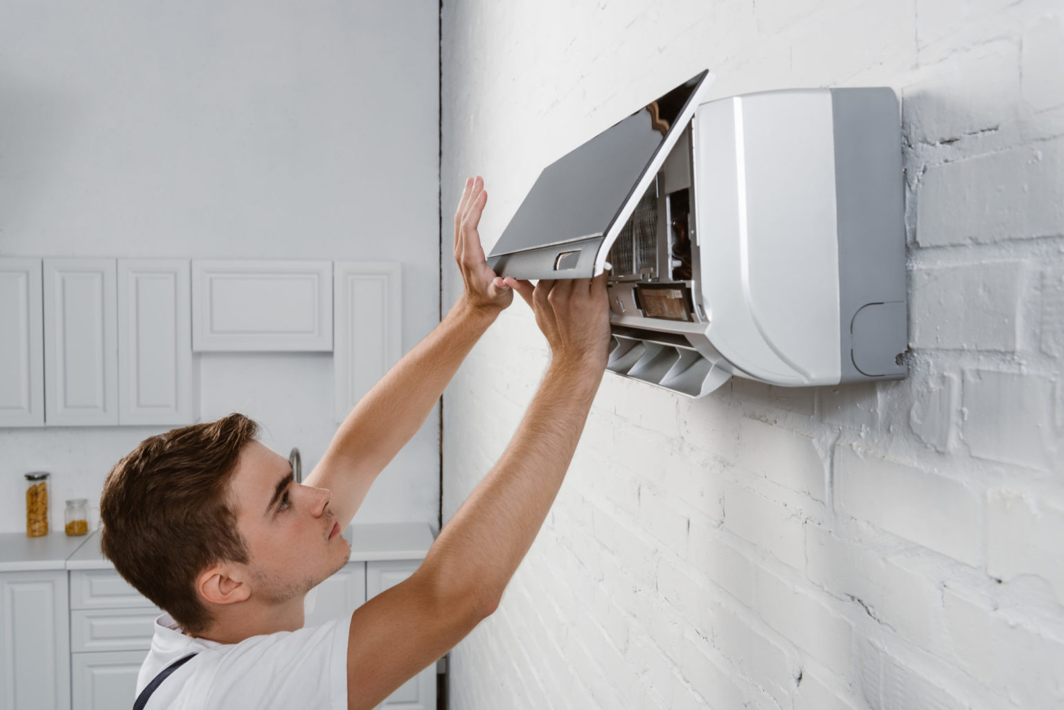 a man holding a computer