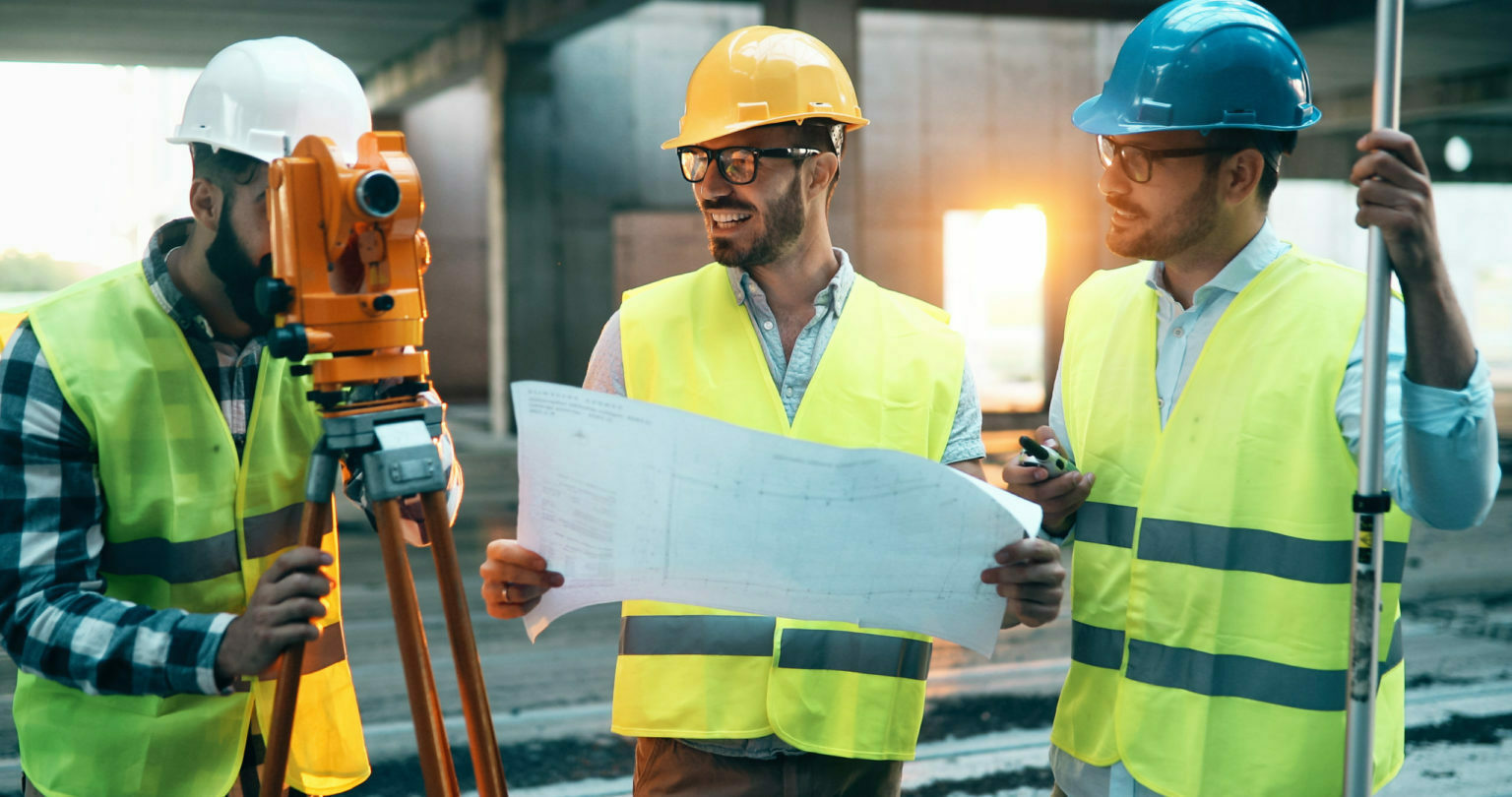 a few men wearing hard hats and hard hats