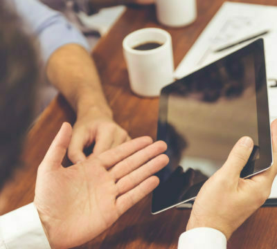 a few hands holding a phone