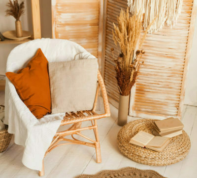 a chair with a basket and a basket with books on it