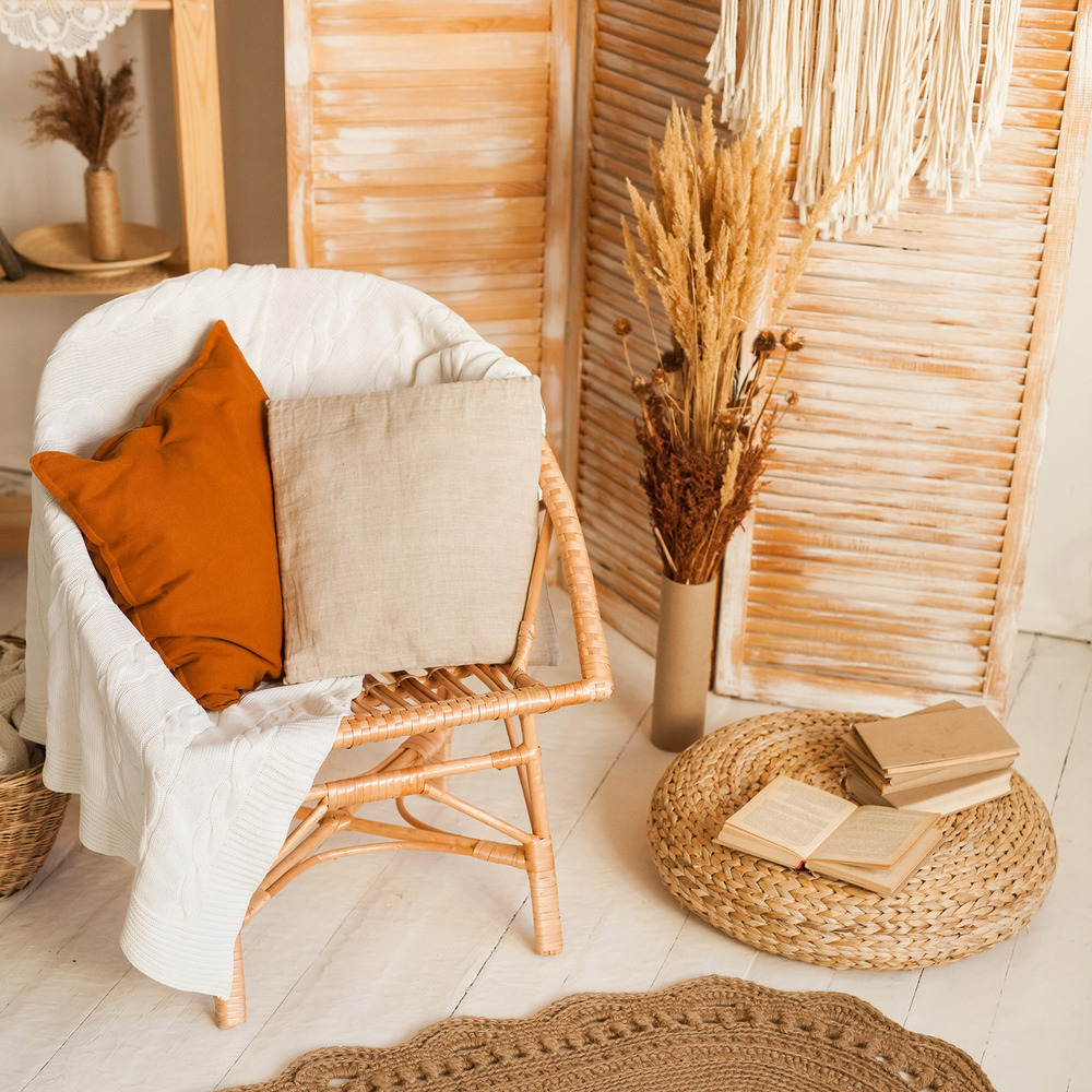 a chair with a basket and a basket with books on it