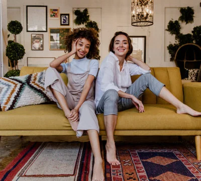 a man and woman sitting on a couch