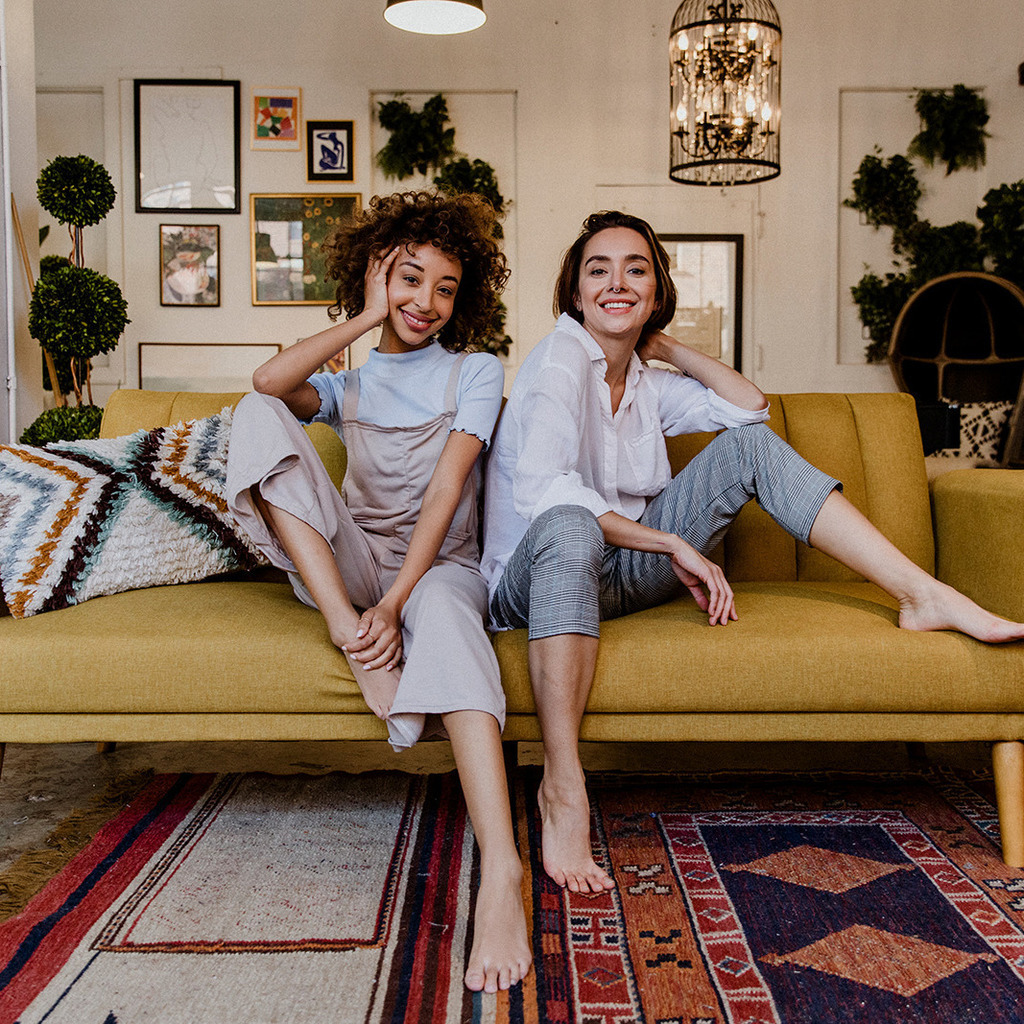 a man and woman sitting on a couch